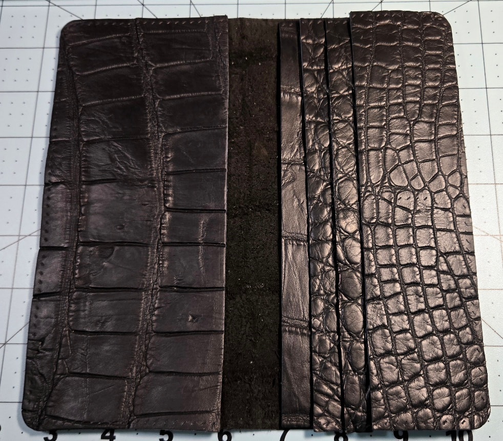 Cut leather pieces laid flat before assembly