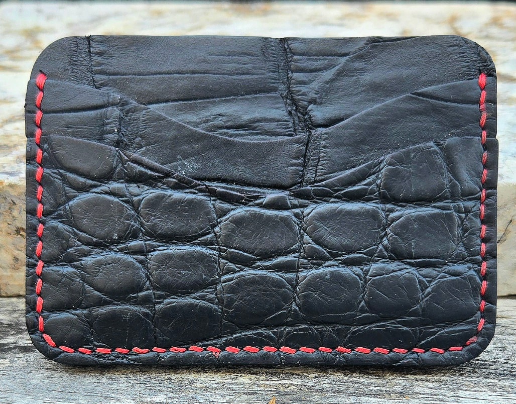 American alligator wallet — cut leather pieces laid out