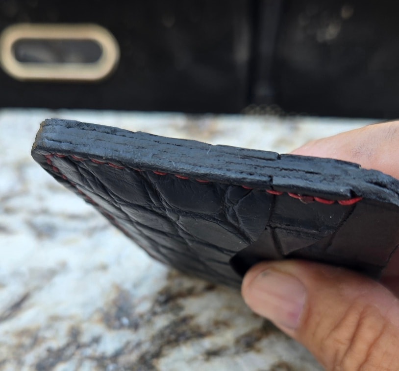 American alligator wallet — edge work close-up, angle 2
