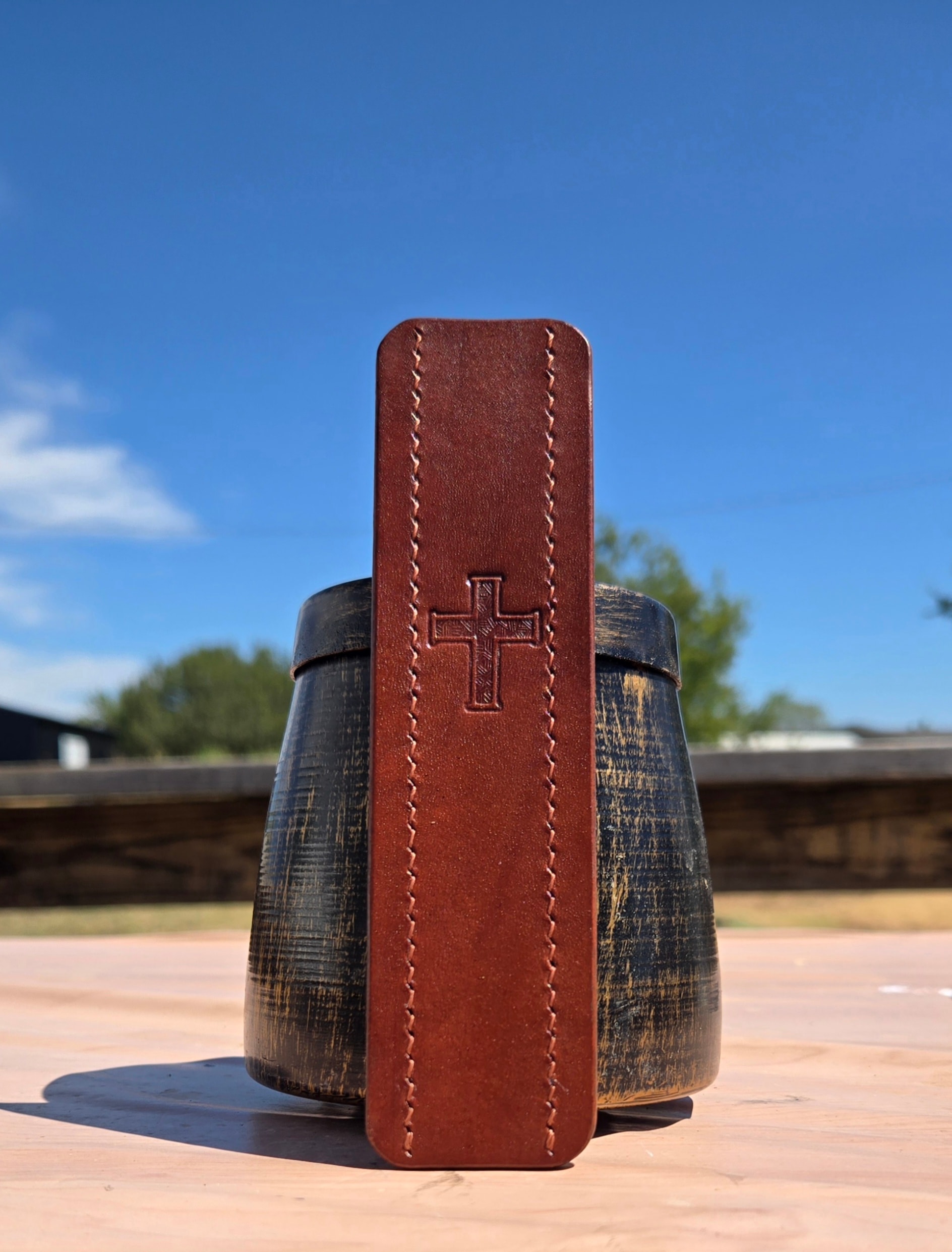 Bookmark front face — cross stamp detail, barrel shot