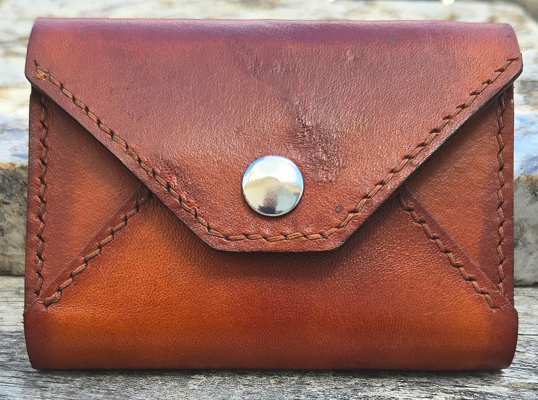 Envelope wallet — snap closure detail