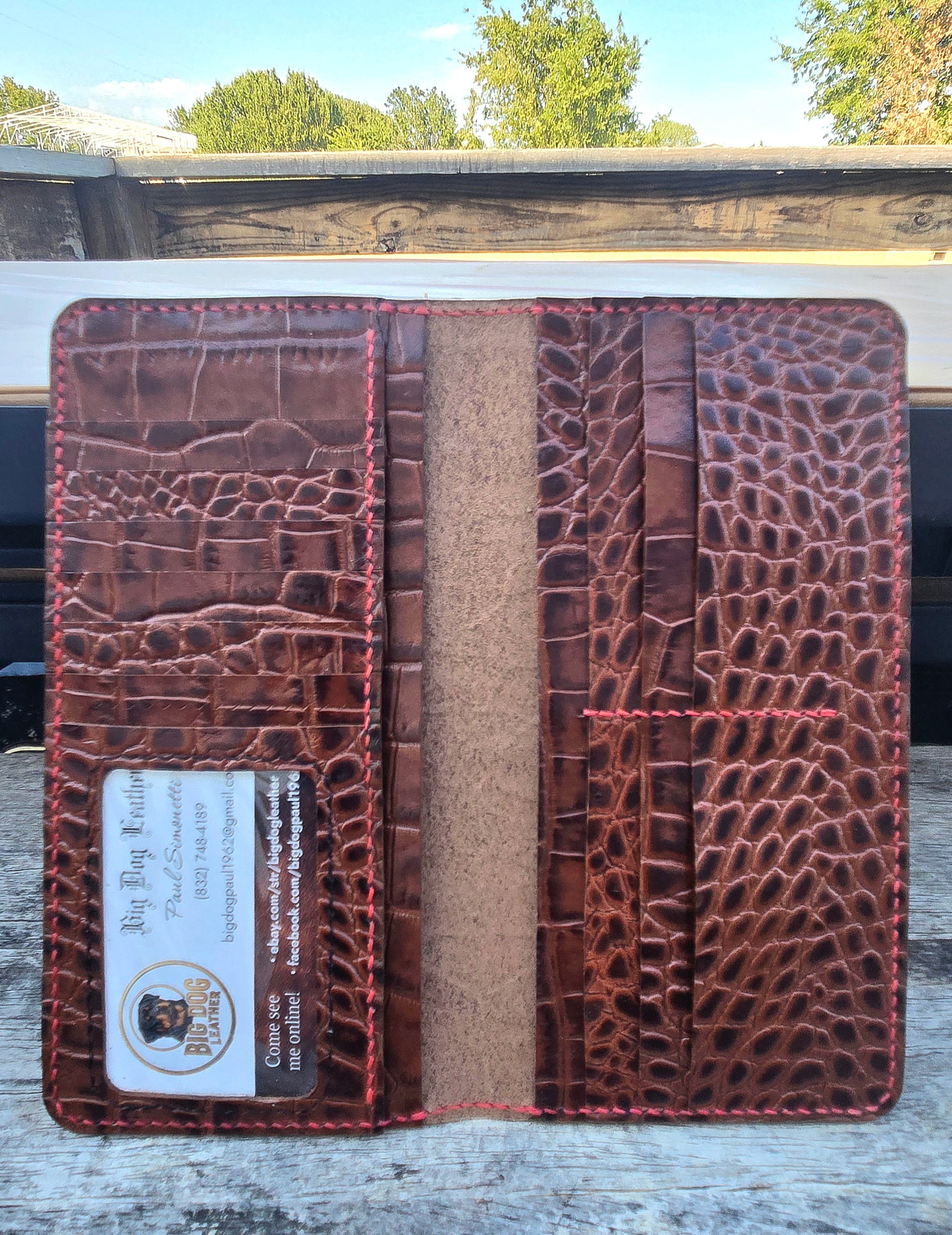 Long wallet open with business card in ID window