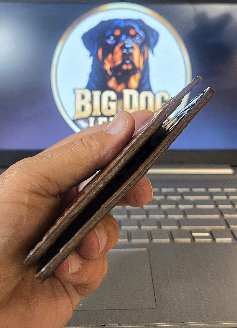 XL1 Mauri croc embossed bifold — edge profile, held in hand